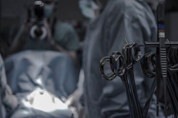 Surgical team in operating theatre during knee replacement procedure