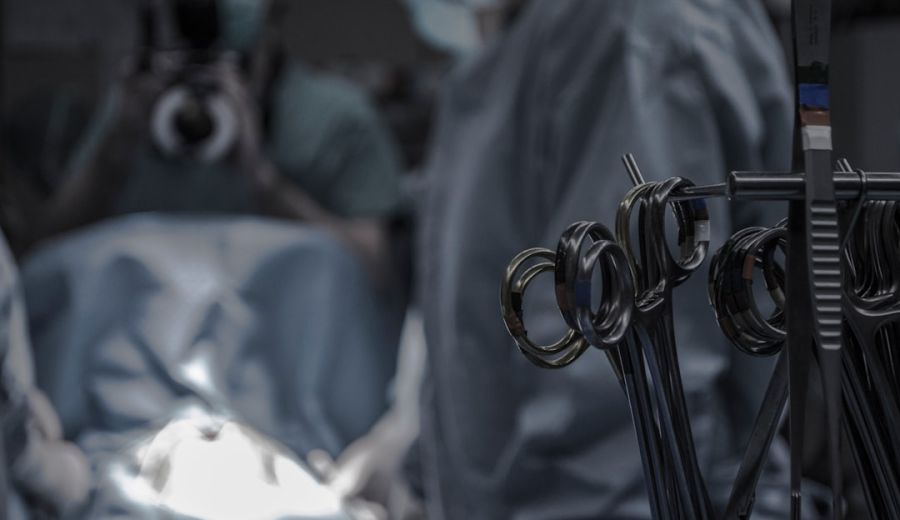 Surgical team in operating theatre during knee replacement procedure