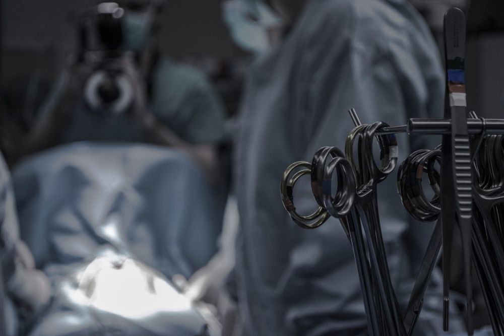 Surgical team in operating theatre during knee replacement procedure